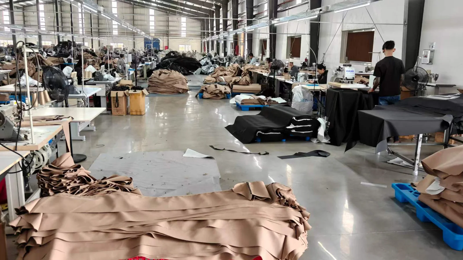 Factory staff assembling finished cover products